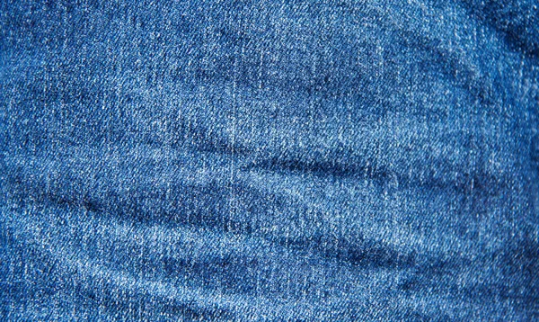 蓝色牛仔裤质地为背景 背景的蓝色牛仔裤面料 — 图库照片