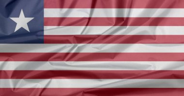 Liberya 'nın kumaş bayrağı. Liberya bayrak arkaplan kırışıklığı, kırmızı ve beyaz 11 yatay çizgi mavi bir alanda beyaz yıldız.