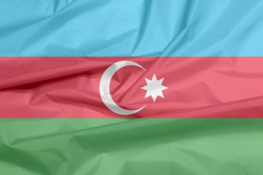 Azerbaycan 'ın bayrağı. Azerbaycan bayrak arkaplan kırışıklığı, mavi, kırmızı ve yeşil, beyaz hilal ve büyük yıldız.