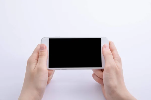 Mani Femminili Che Tengono Nuovo Moderno Smartphone Nero Isolato Sfondo — Foto Stock