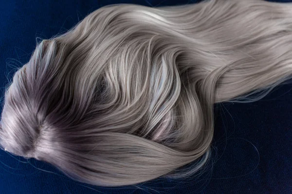 Wigs synthetic and natural hair. Blonde and ash blonde hair. Womens beauty concept