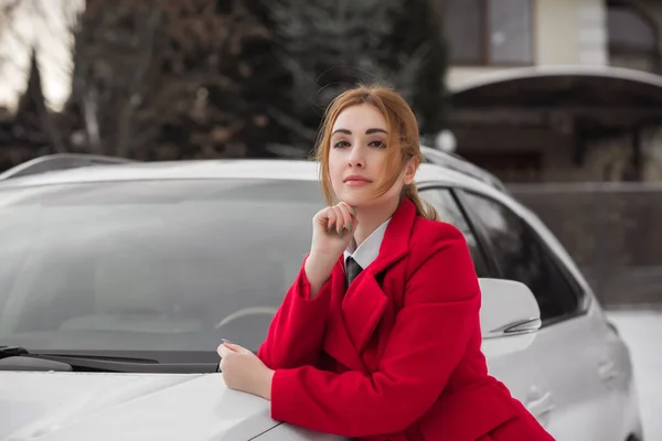 Business lady style, woman with a car, concept of modern young lady lifestyle