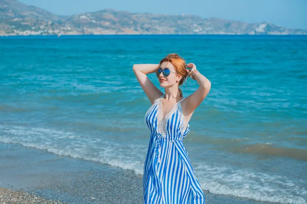 Spring - Summer season. Vacation and travelling time. Woman at sea, pretty nice view