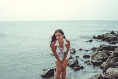 No retouch beauty, body positive. Young simple plus size indian girl in swimwear enjoying vacation, woman with xl figure, pretty girl, vintage texture