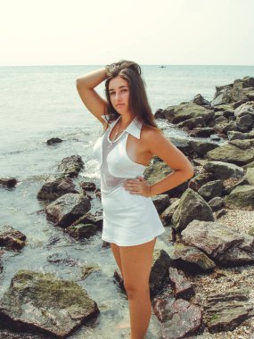 No retouch beauty, body positive. Young simple plus size indian girl in swimwear enjoying vacation, woman with xl figure, pretty girl, vintage texture