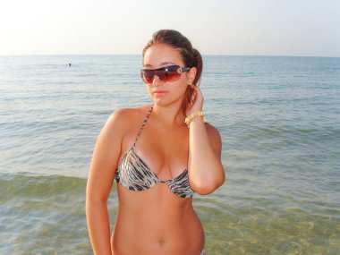 No retouch beauty, body positive. Young simple plus size indian girl in swimwear enjoying vacation, woman with xl figure, pretty girl, vintage texture