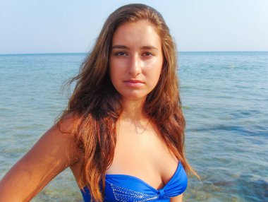 No retouch beauty, body positive. Young simple plus size indian girl in swimwear enjoying vacation, woman with xl figure, pretty girl, vintage texture