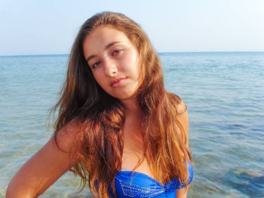 No retouch beauty, body positive. Young simple plus size indian girl in swimwear enjoying vacation, woman with xl figure, pretty girl, vintage texture