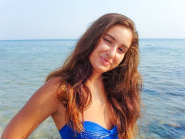 No retouch beauty, body positive. Young simple plus size indian girl in swimwear enjoying vacation, woman with xl figure, pretty girl, vintage texture