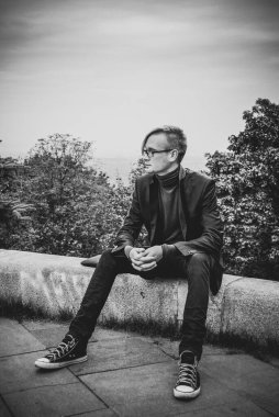 Handsome guy walking around, Student at city street, college or university lifestyle time 