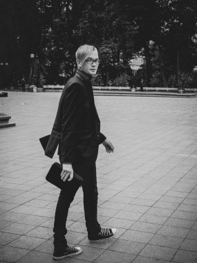 Handsome guy walking around, Student at city street, college or university lifestyle time 