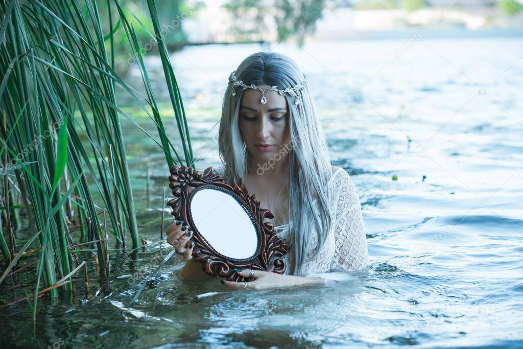 Old European magic, Mystical Pagan scene, woman in lake, rituals. Magic divination in water, ritual. Psychic vision, fortune teller