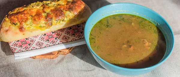 Homemade mushroom soup with cheese roll