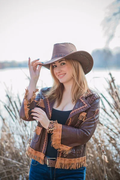 Cowgirl American Autumn Style Full Figure Woman Leather Jacket Jeans Stock Image