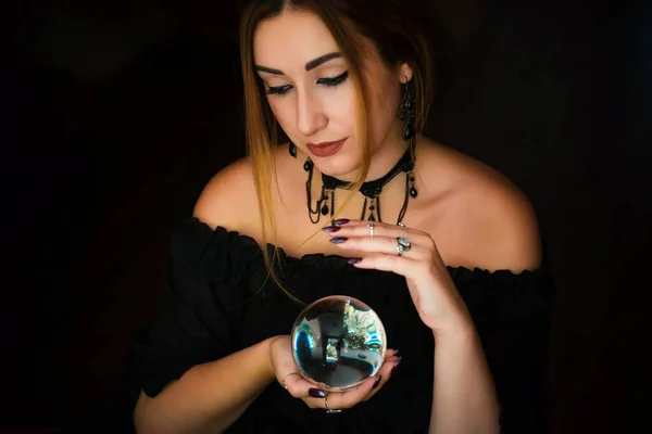 Woman fortune teller on a crystal ball, Concept of predictions, magic rituals and wicca