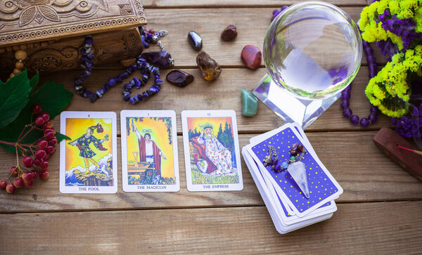 Tarot card on a table, White magic, attributes for witch,  magic for love, health, attracting happiness . Esoteric concept