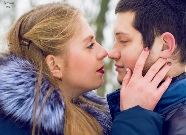 Young lovers man and woman on a date. Enamoured young man and woman