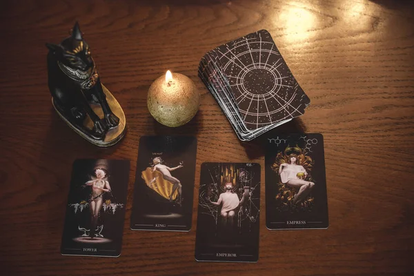 Tarot cards, candles, witch magic objects. Wicca, esoteric, divination and occult background with vintage magic stuff for mystic rituals