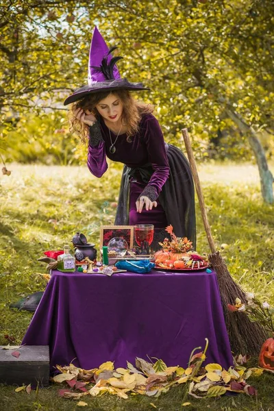 Wizard cosplay. Ideas for Halloween party, concept of autumn holidays, Woman in witch costumes, dcor and design for party