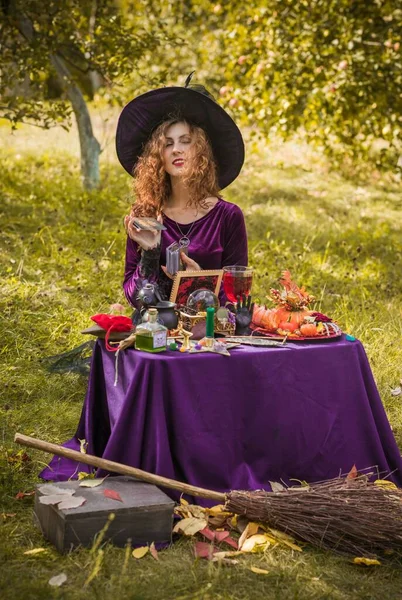 Wizard cosplay. Ideas for Halloween party, concept of autumn holidays, Woman in witch costumes, dcor and design for party