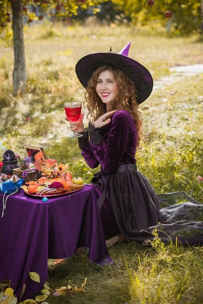 Wizard cosplay. Ideas for Halloween party, concept of autumn holidays, Woman in witch costumes, dcor and design for party