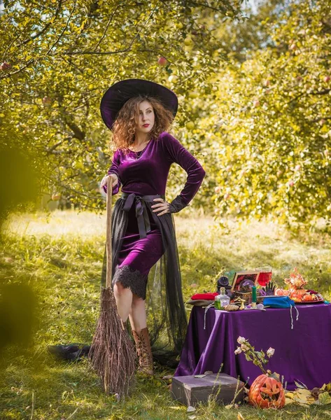 Wizard cosplay. Ideas for Halloween party, concept of autumn holidays, Woman in witch costumes, dcor and design for party