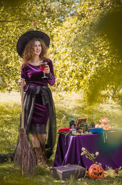 Wizard cosplay. Ideas for Halloween party, concept of autumn holidays, Woman in witch costumes, dcor and design for party