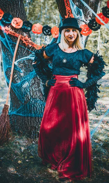 Wizard cosplay. Ideas for Halloween party, concept of autumn holidays, Woman in witch costumes, decor and design for party