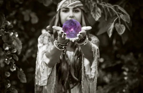 Gypsy woman fortune teller with a crystal ball, Concept of predictions, magic rituals