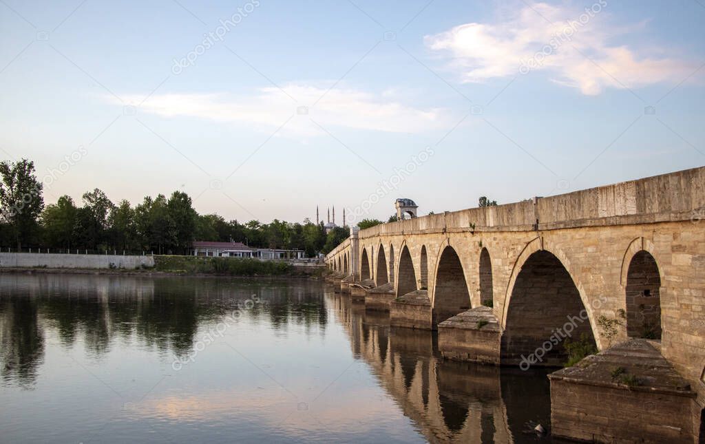 Historical old Meric Bridge Mecidiye Bridge) on Meric River. Edirne, Turkey. Selimiye Mosque and Meric Bridge all in one.