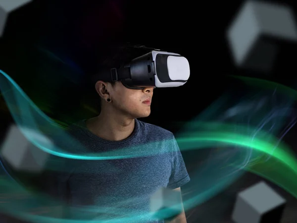 Visual reality concept.Young Asian man using Visual reality or VR headset man getting experience using VR-headset glasses.