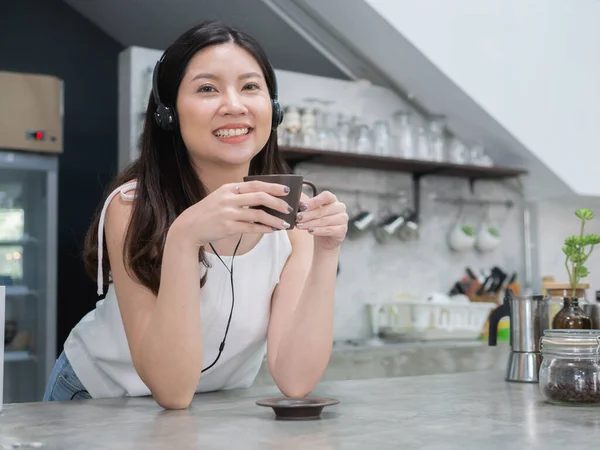 happy asia woman enjoy drinking coffee in coffee shop