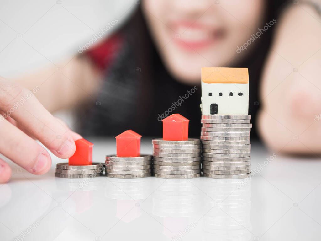 Mortgage concept by money house from the coins,Business Finance and Money concept,Saving concept to buy a house.