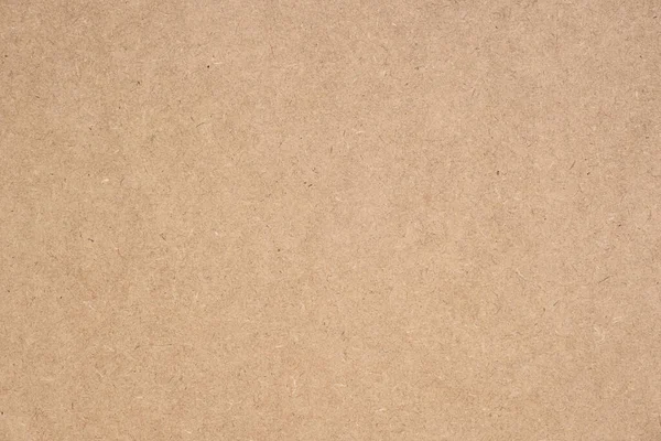 Texture of brown craft or kraft paper background, cardboard sheet, recycle paper, copy space for text.