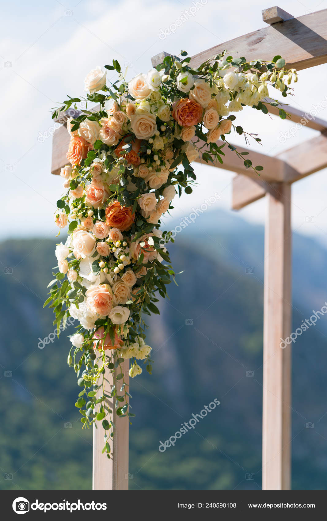 Beautiful Wooden Wedding Arch Decorated With Flowers Stock Photo