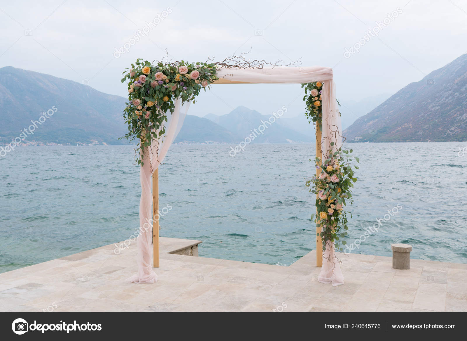 Wooden Rectangular Wedding Arch Decorated With Flowers Stock