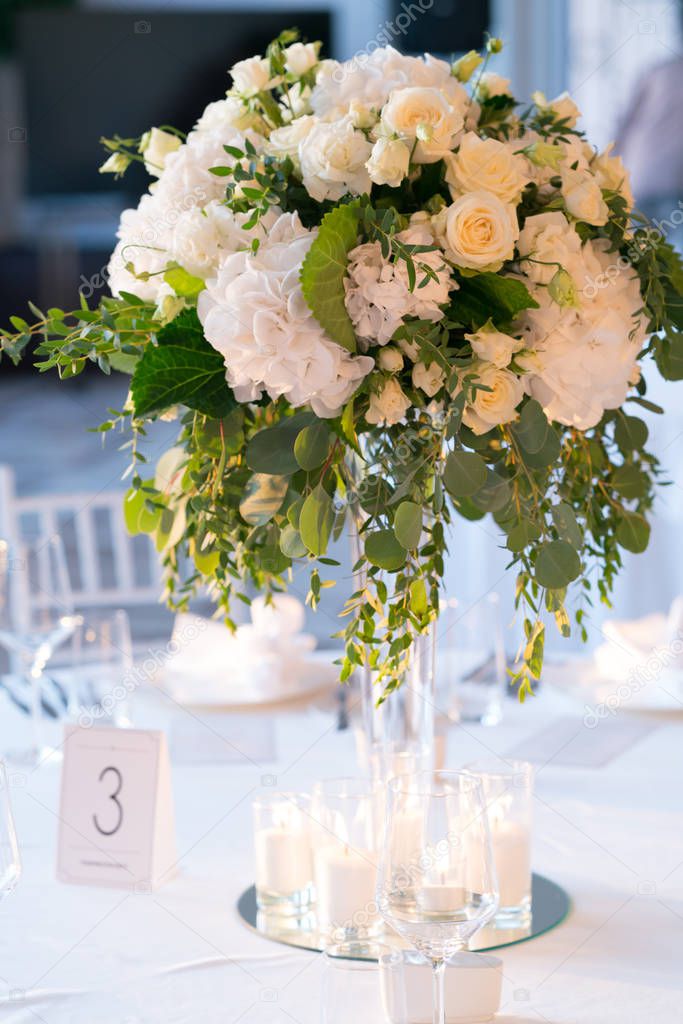 flower arrangement on a table for a wedding dinner