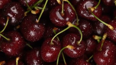 Taze, olgun, sulu kiraz arka plan, yakın berry, zoom ile rotasyon. Gastronomi kavramı, organik gıda.