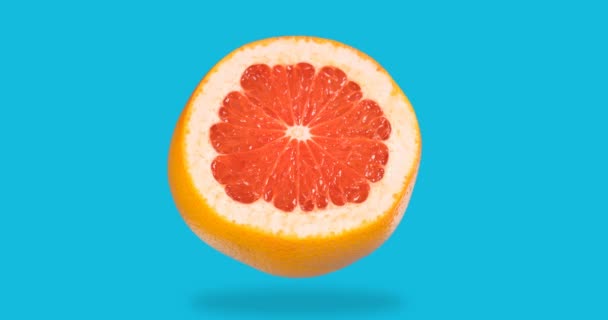 Animación stop motion de pomelo fresco desaparece, aparece sobre un fondo azul — Vídeos de Stock