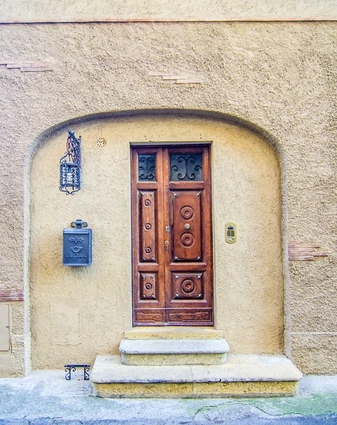 ancient door with arch, in wood consumed by the use of historical building