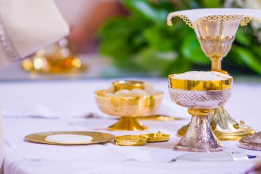 altar with consecrated host that becomes the body of jesus christ and chalice for wine, blood of christ, in the church of francesco papa in rome clipart