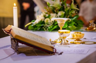 altar with consecrated host that becomes the body of jesus christ and chalice for wine, blood of christ, in the church of francesco papa in rome clipart