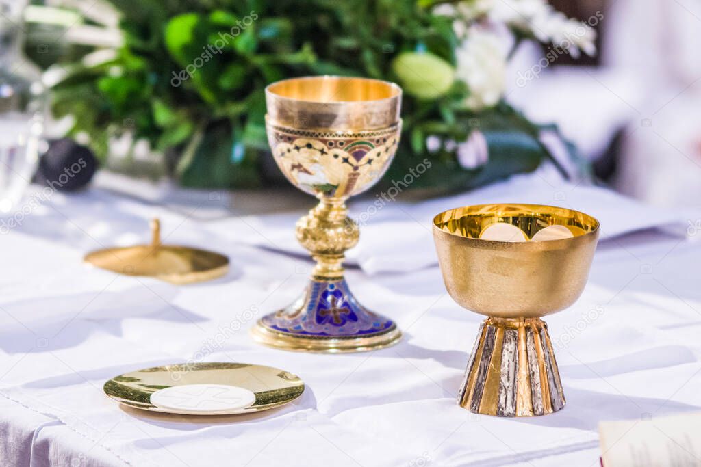 altar with consecrated host that becomes the body of jesus christ and chalice for wine, blood of christ, in the church of francesco papa in rome