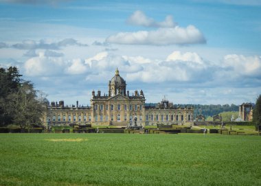 York, UK - May 01 2017: Castle Howard surrounded by beautiful clouds clipart