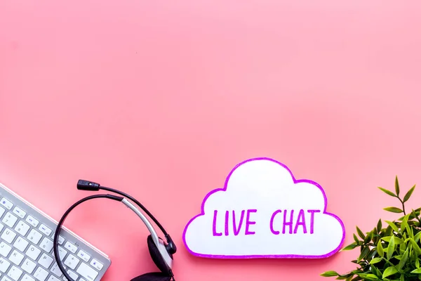 Live chat communication concept - words on pink background top view