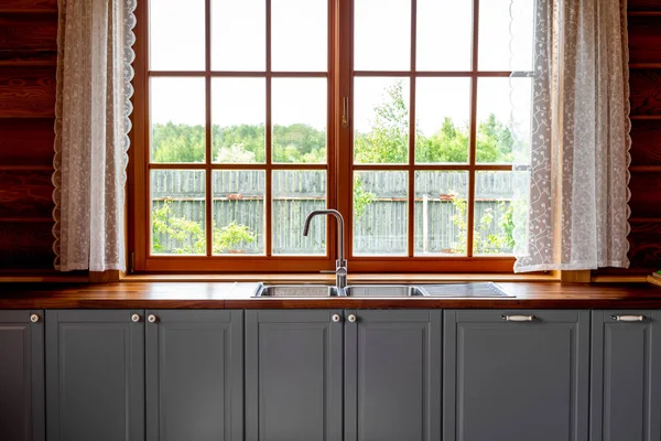 Kitchen interior design of a wooden cottage