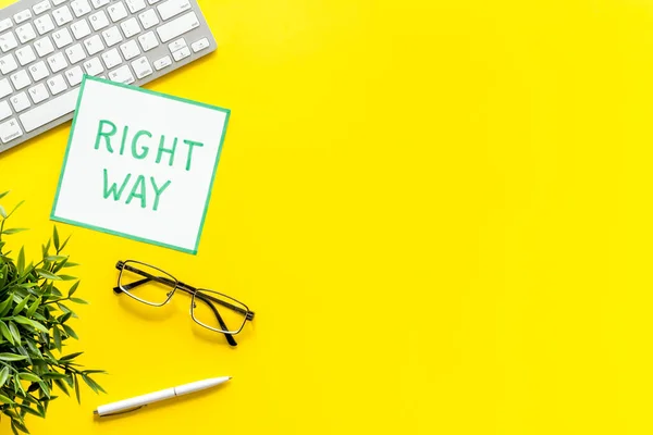 Right way icon on yellow office desk top view copy space