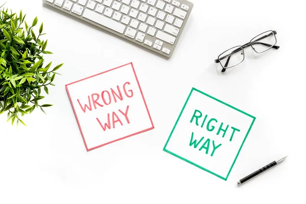 Problem solving. Right and wrong way icons on work desk from above