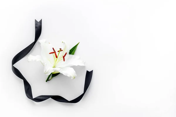 Condolence card with white flowers lily, from above