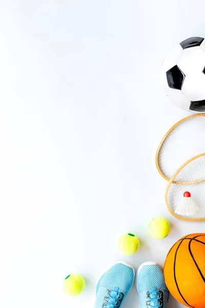 Flat lay of sport balls - football, basketball on white background copy space